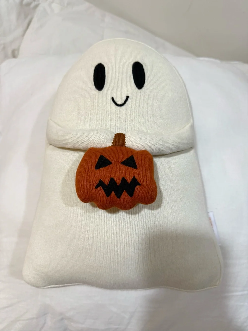 Cream Ghost Holiday Pillow with Orange Pumpkin Accent